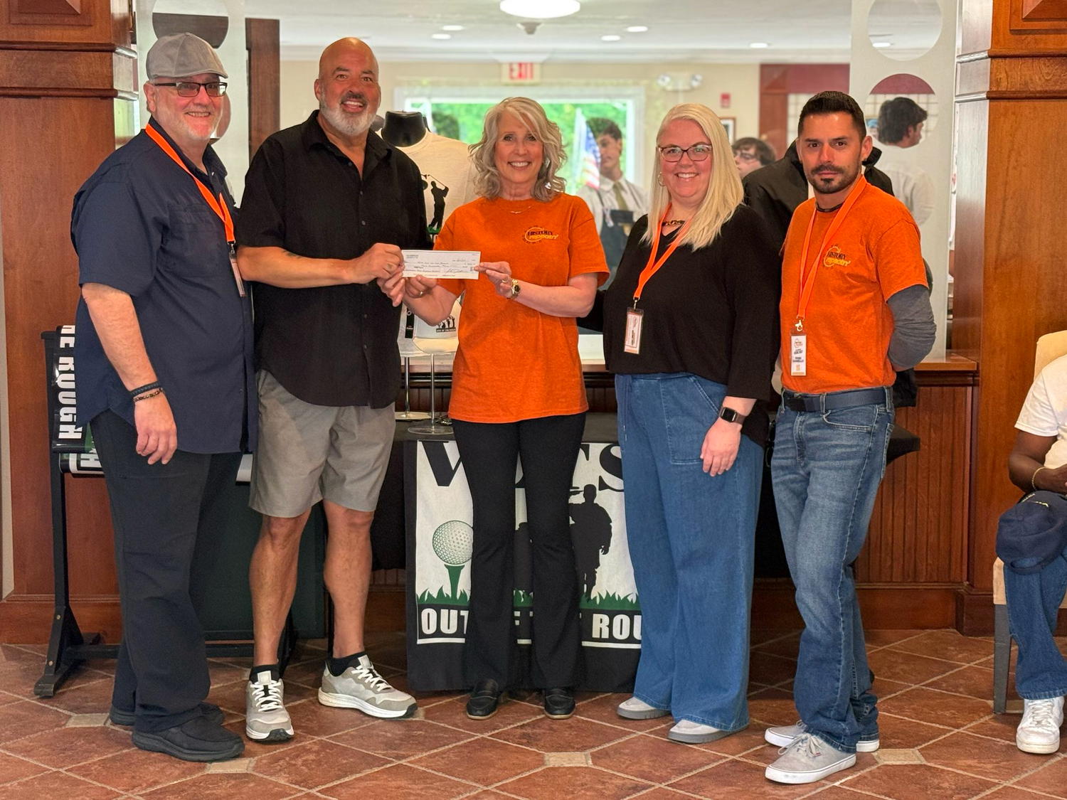 History Repeatn’s Carol Taylor, John Daniello, Peter Gallo, and Jessica Driscoll present a $500 donation to Veterans Out of the Rough, a nonprofit organization helping Long Island veterans through golf, camaraderie and connection.
